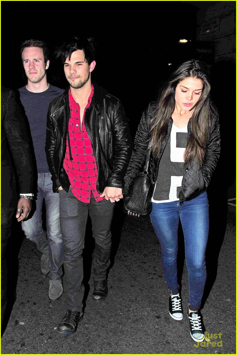 taylor lautner marie avgeropoulos matching jackets london 17